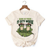 Hang In There It Gets Worse T-Shirt, White and Natural Funny Frog Tee with Dark Millennial Humor